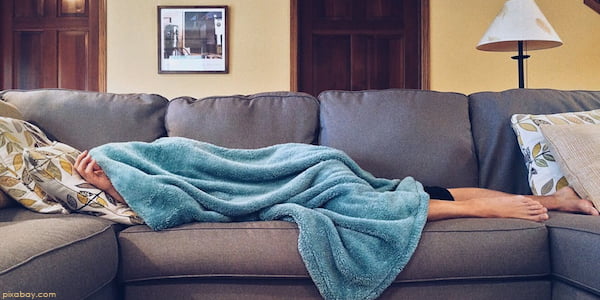 person asleep on sofa